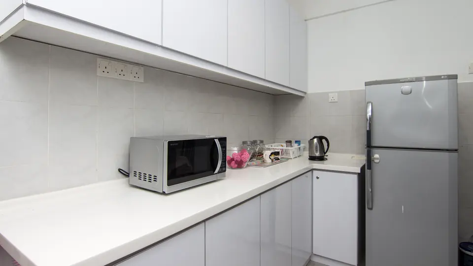 Kitchen with microwave and fridge